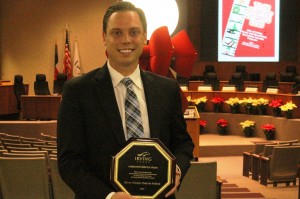 Gunnar Peters holding the Community Service Award